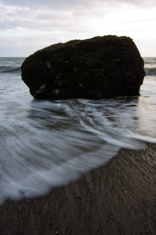 Waves Breaking Around Rock